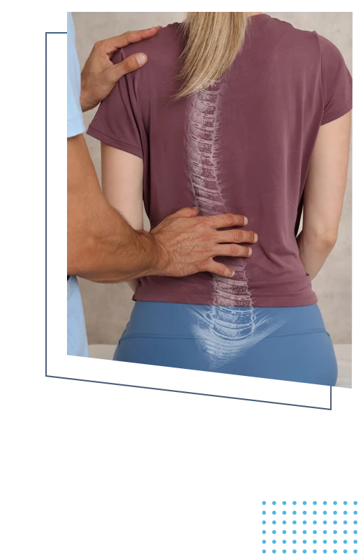 A doctor examining a patient's spine before an adjustment