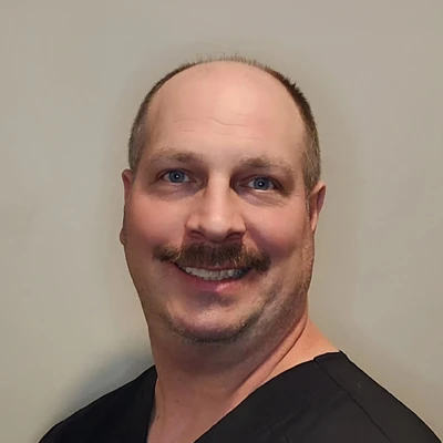 A headshot photo of Brad